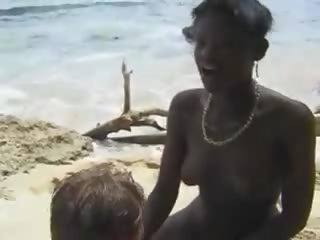 Hairy African mistress fuck Euro young lady in the Beach